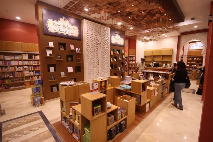 

Location:Mall Of Arabia, Cairo
               Year:2011
               Status:Completed </div>

After establishing their signature interior design theme in Mirghany, Zamalek, and Le Marche (Alex.) branches, the Alef branch in MOA added several new ideas to the bookstore's I.D. theme. As you approach the branch, you are struck by the central Alef logo artwork made of gypsum panels and illuminated colored glass. Upon entering you are greeted with our 2 X 5m light installation ‘Pixel Cloud’ and a movable multi-use central display unit that could also be used for informal seating, thus turning the center into a lively flexible hang-out space. This is further complimented by Alef café, which promotes the bookstore chain, not only as a place for selling books, but also as a place for recreational public gatherings.