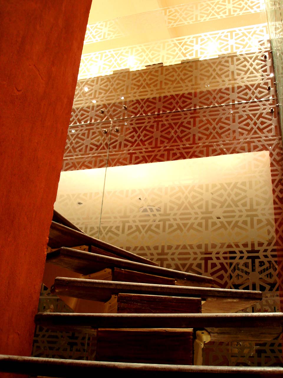 

<div style=color:#000>Location:Al-Zamalek, Cairo 
               Year:2010
               Status:Completed </div>
 The interior design theme is a continuation of the andalusian style that characterizes the bookstore chain. In this branch, which stretches over 2 floors, a central wooden staircase spiraling inside an illuminated glass cube lightens up the whole space beneath and connects both floors while it acts as a generator for chance encounters by remaining in a state of constant flux