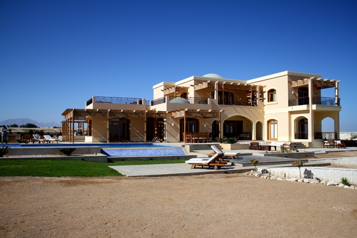 
<div style=color:#000>Location:Hurghada 
               Year:2009 
               Status:Completed </div>
For this house, located in a magical site overlooking the red sea, we developed a landscape design that reflected the unique desert conditions with a touch of modern pure geometry. This contrast between nature’s flowing lines and the manmade formal geometries was central to our design. The idea was based on a cluster of shifted floating planes that slide on one another to blend with the site’s topography and create a continuous reach towards the sea.